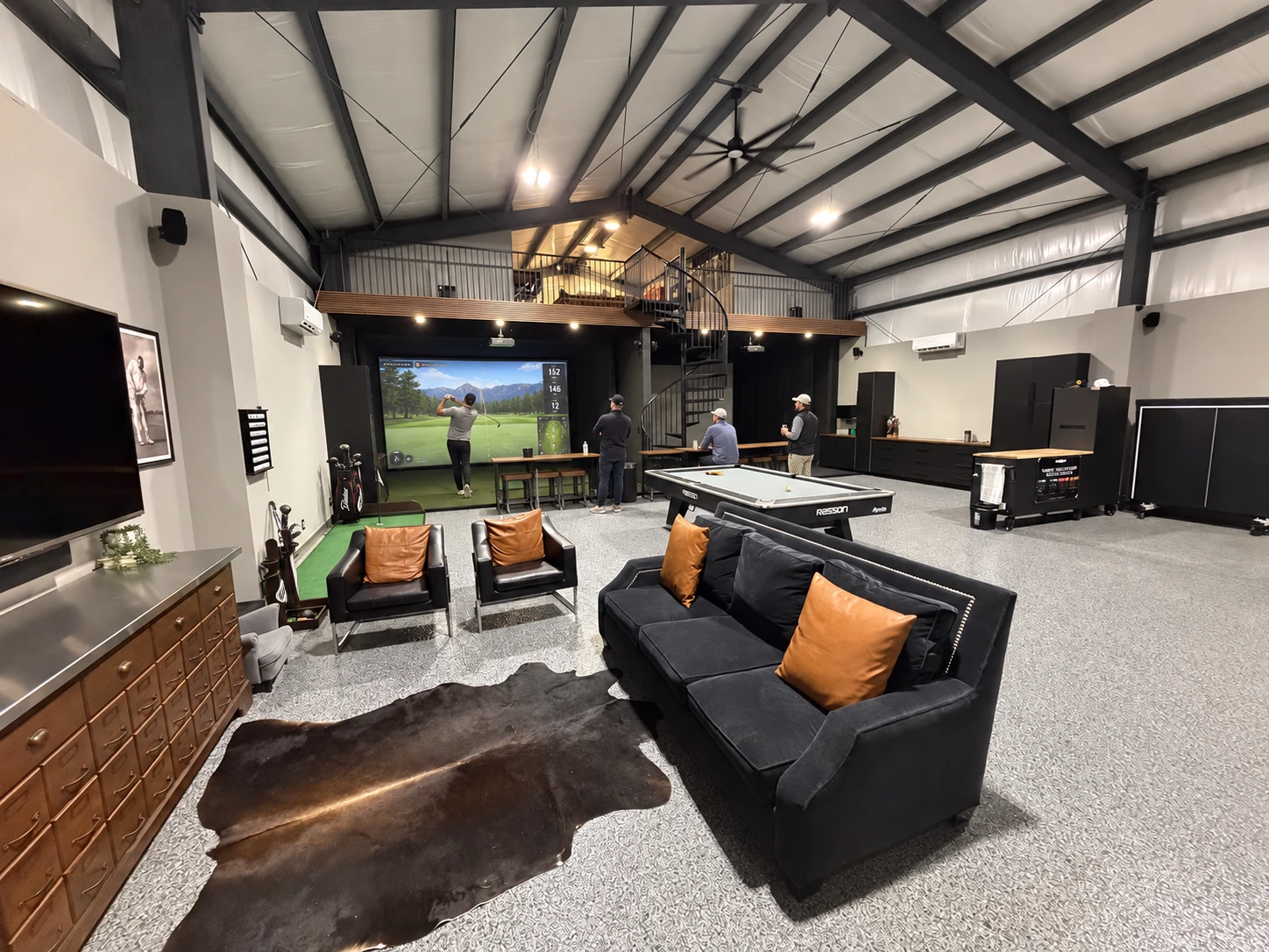 Indoor golf bays and lounge at Elevation Golf